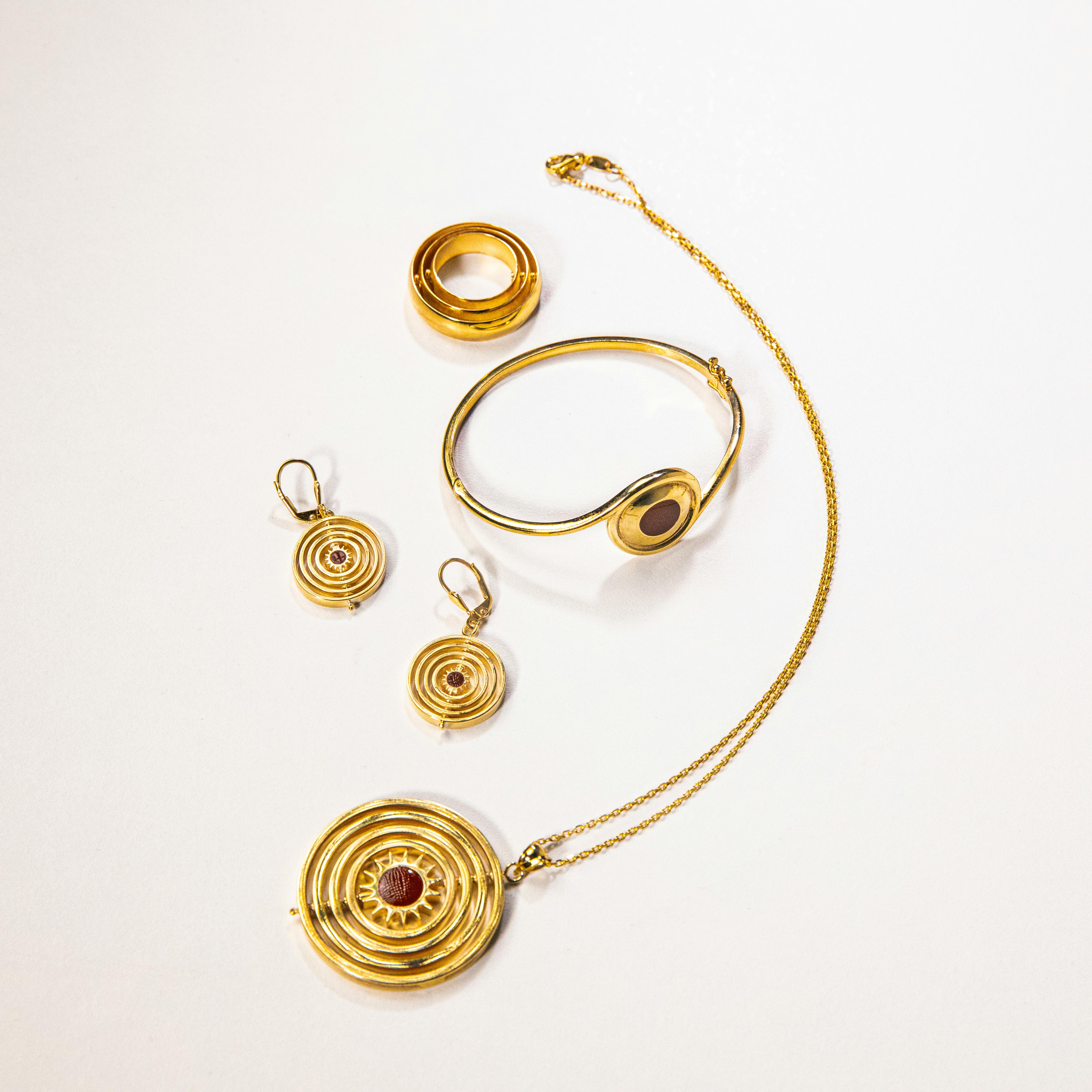 Gold jewelry set on white background