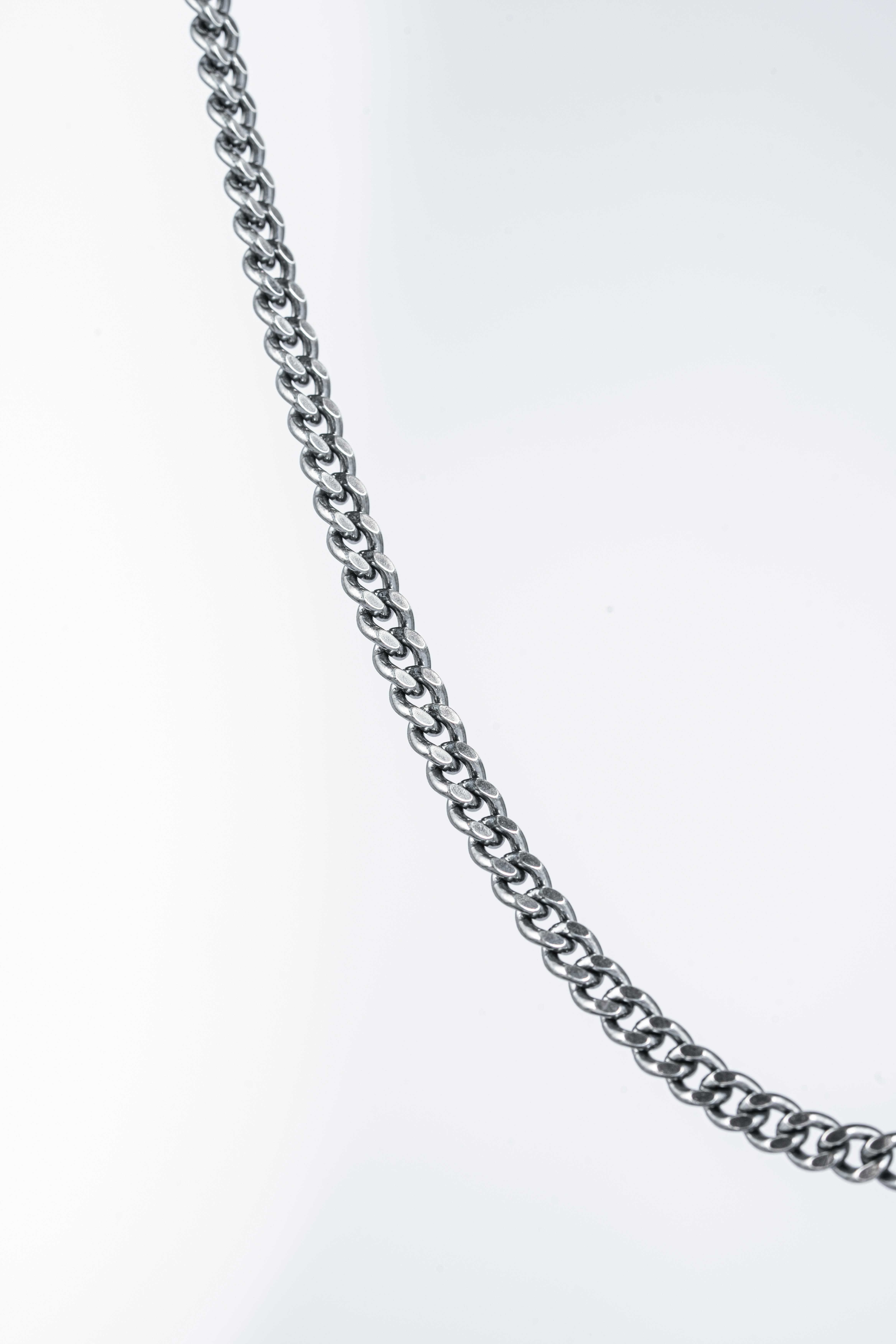 Silver chain on white background